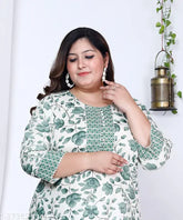 Green and white floral print plus size cotton straight kurta for women, three-quarter sleeves on a model